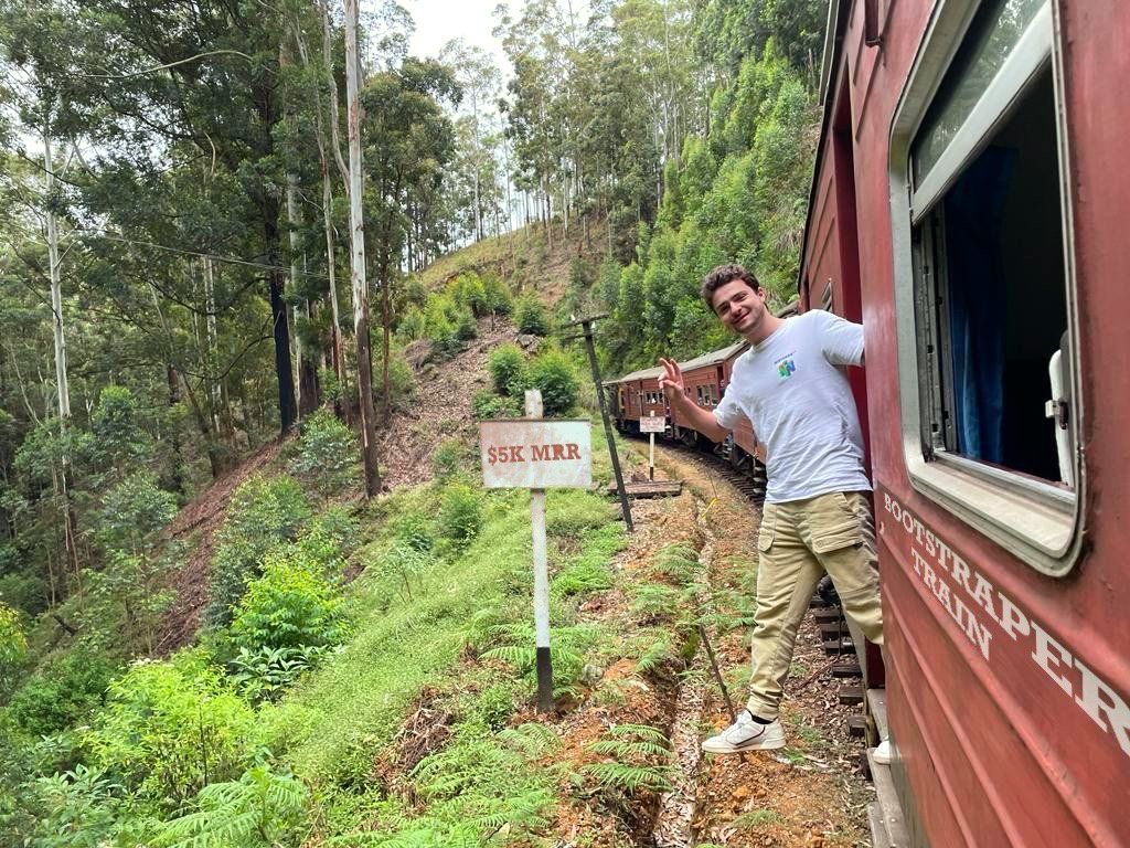 Julien leaning out of train